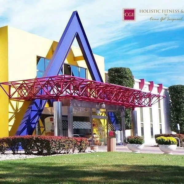 The original CGI Holistic Fitness building with its purple A-frame entrance