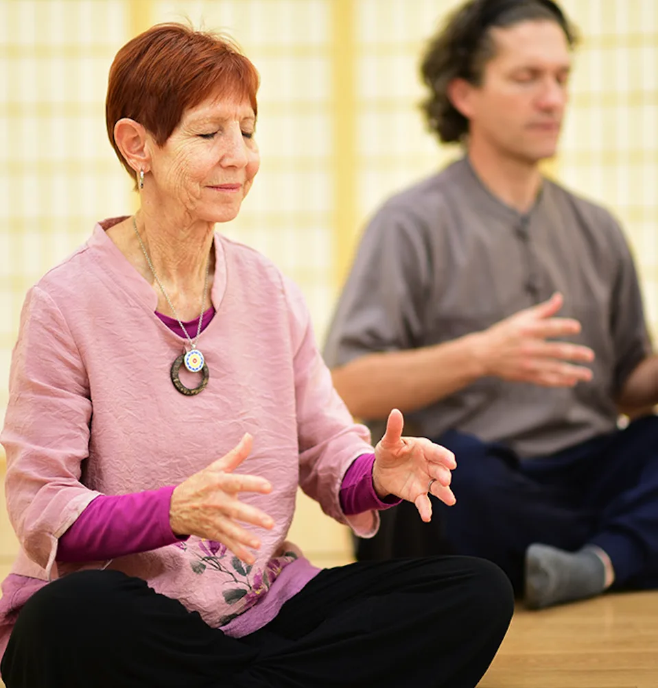 Guided meditation session at CGI: students seated with eyes closed